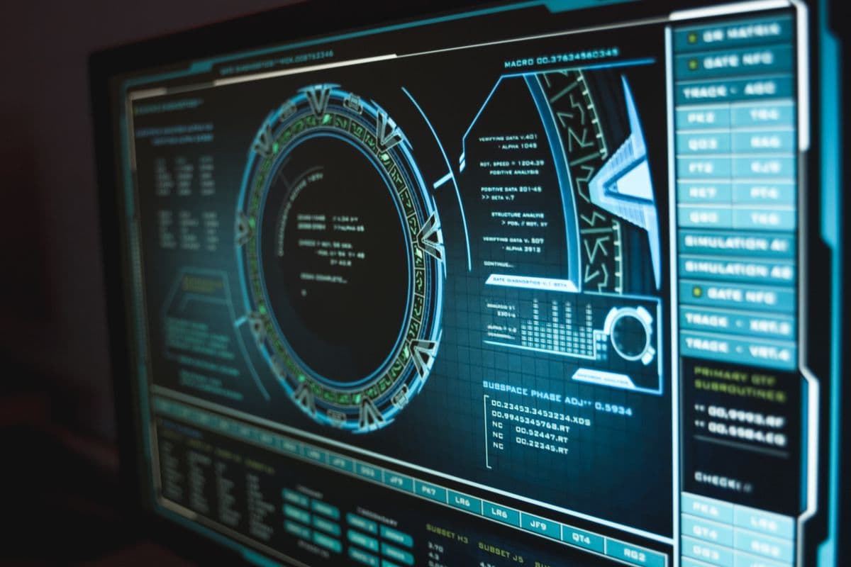A futuristic on-screen interface reading 'verifying data' with circular diagnostic graphics
